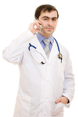 Fototapeta premium Male doctor talking on the phone on a white background.