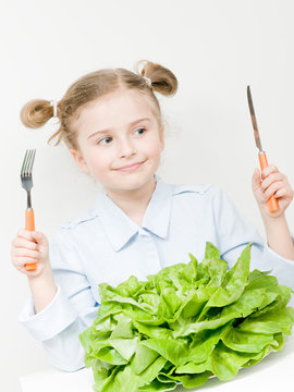Vegetarian food - lovely girl with fresh lettuce