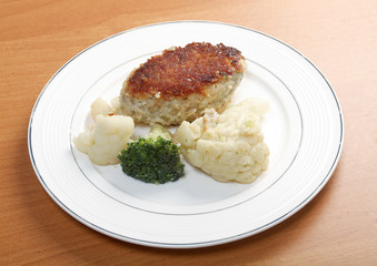 Cutlets in a plate with vegetables