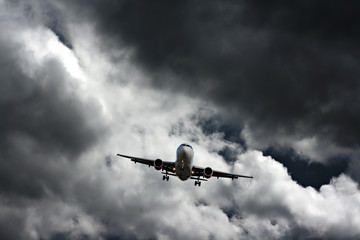 Passenger plane against stormy sky