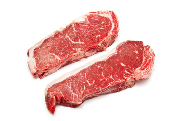 Sirloin steaks (beef) isolated on a white studio background.