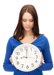 woman holding big clock