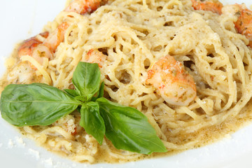 Tagliolini with pesto and shrimps closeup