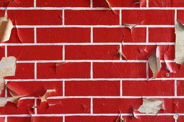 Old wall with flaky paint. Pattern of bricks.