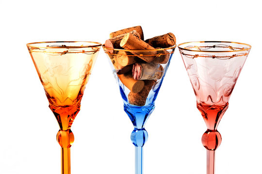 Three color wine glasses with corcs for wine