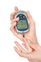patient measuring glucose level blood test