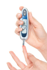 Diabetes patient hands measuring glucose level blood test