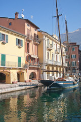 Sailing boat in the harbor of Malcesine on Lake Garda Italy