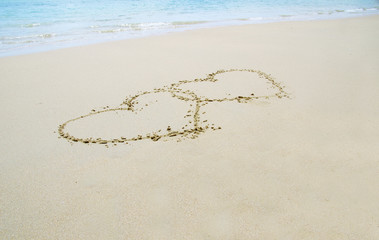 hearts drawn in sand