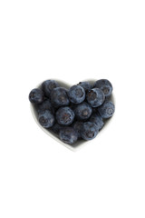 Delicious blueberries formed into a heart shape