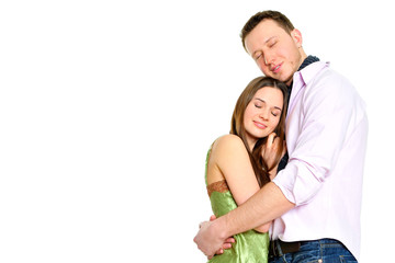 Portrait of young couple standing together and embracing