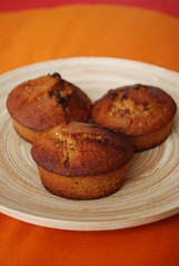 Homemade muffins with hazelnuts, orange peel and raisins