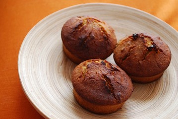 Homemade muffins with hazelnuts, orange peel and raisins