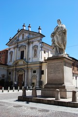 Obraz premium Small church and statue in town center, Novara, Piedmont, Italy