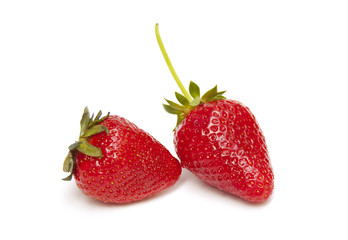 Two strawberries on white