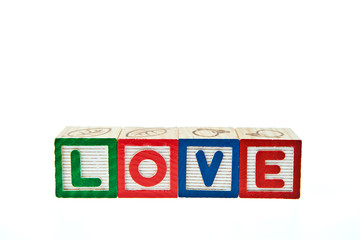 Love by block toy isolated on white background