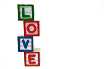 Love by block toy isolated on white background