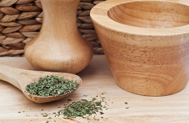 Chopped tarragon in rustic kitchen setting with wooden utensils