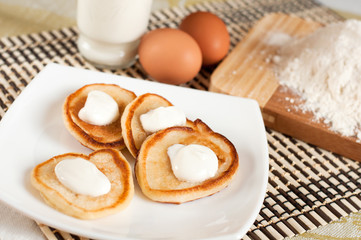 Home pancakes with sour cream, flour and eggs