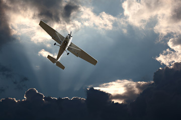 Small fixed wing plane against a stormy sky - 39756597