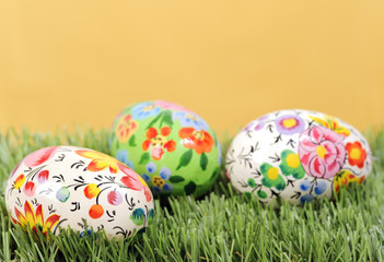 Decorated easter eggs on yellow background