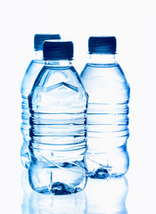 Naklejka premium purified spring mineral water in the bottles with reflection
