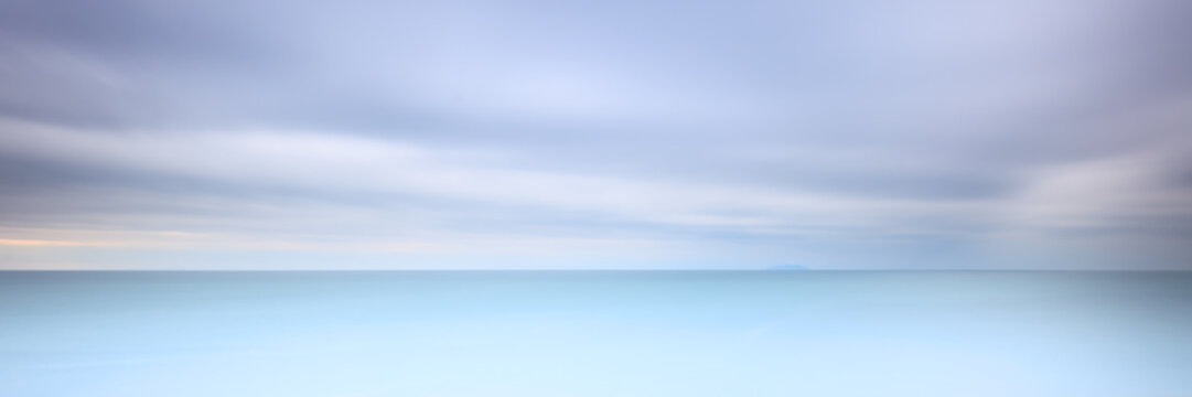 Long exposure photography panorama 3:1 with soft sea and cloudy