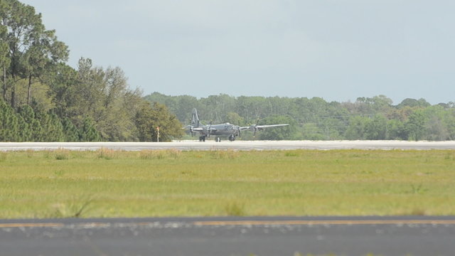 World War II bomber taxiing in summer haze