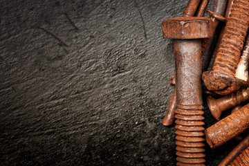 Nuts and bolts on a  metallic background