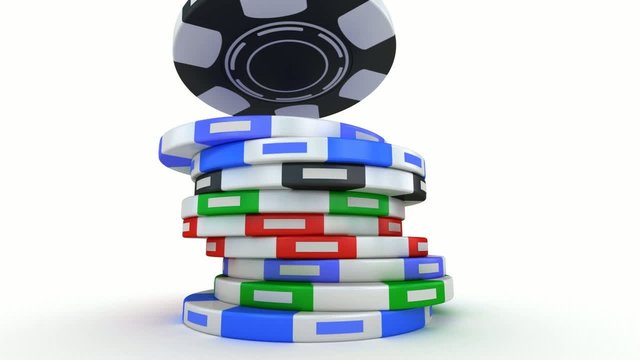 Poker gambling chips falling in pile