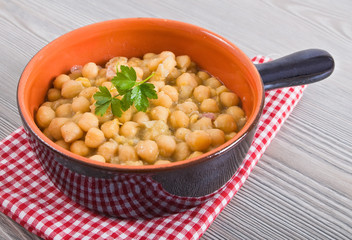 Chickpea soup in terracotta bowl. Zuppa di ceci.