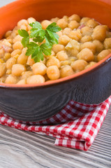 Chickpea soup in terracotta bowl. Zuppa di ceci.