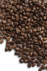 Roasted coffee beans on white background