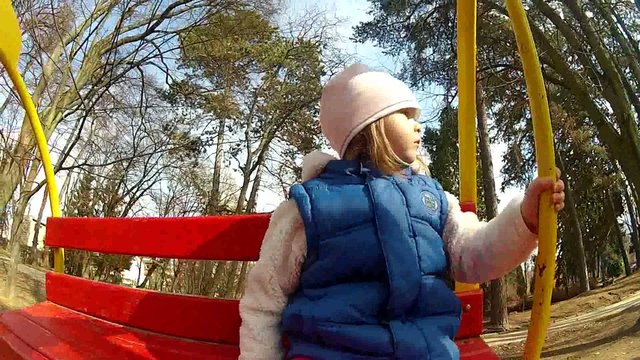 Cute little baby at the swing