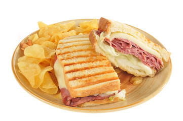 Grilled roast beef and panini sandwich and chips