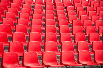 Red stadium seats on the stand