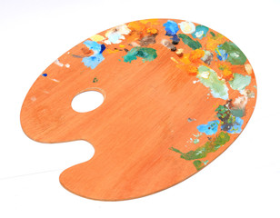 palette with paint on white background