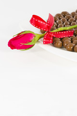 Chocolate heart and rose in the Valentine's Day