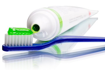 Toothbrush and toothpaste in a tube - obrazy, fototapety, plakaty