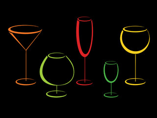Color glasses of alcohol drinks on black