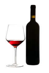 Glass of red wine and a bottle isolated over white background