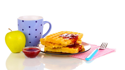 Tasty waffles with jam on plate isolated on white
