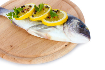 Fresh fish with lemon, parsley and pepper