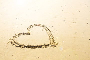 Heart drawn on sand.