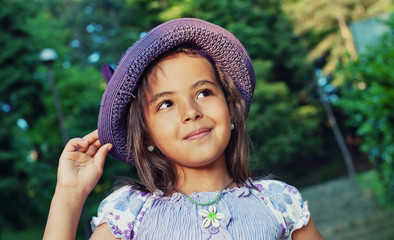 Portrait of  happy little girl in a summer day