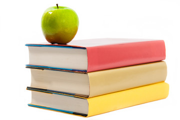 Green Apple on Red, Gold and Yellow Books