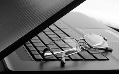 Glasses on laptop