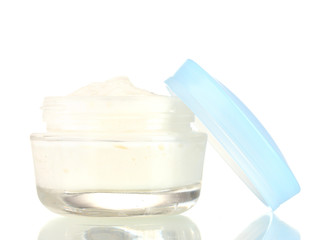 Opened glass jar of cream isolated on white