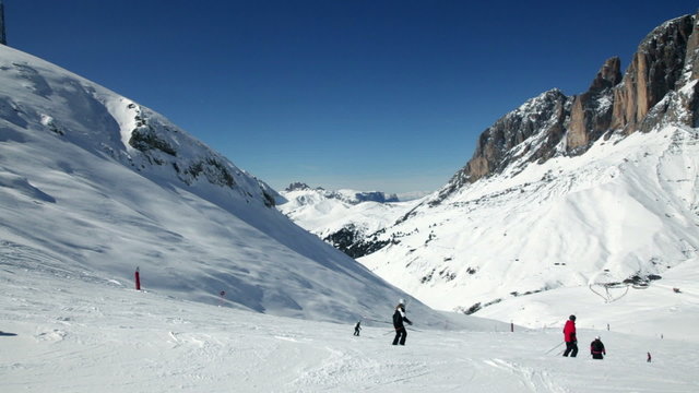 Skiers on a piste