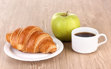 Classical breakfast. Coffee and croissant